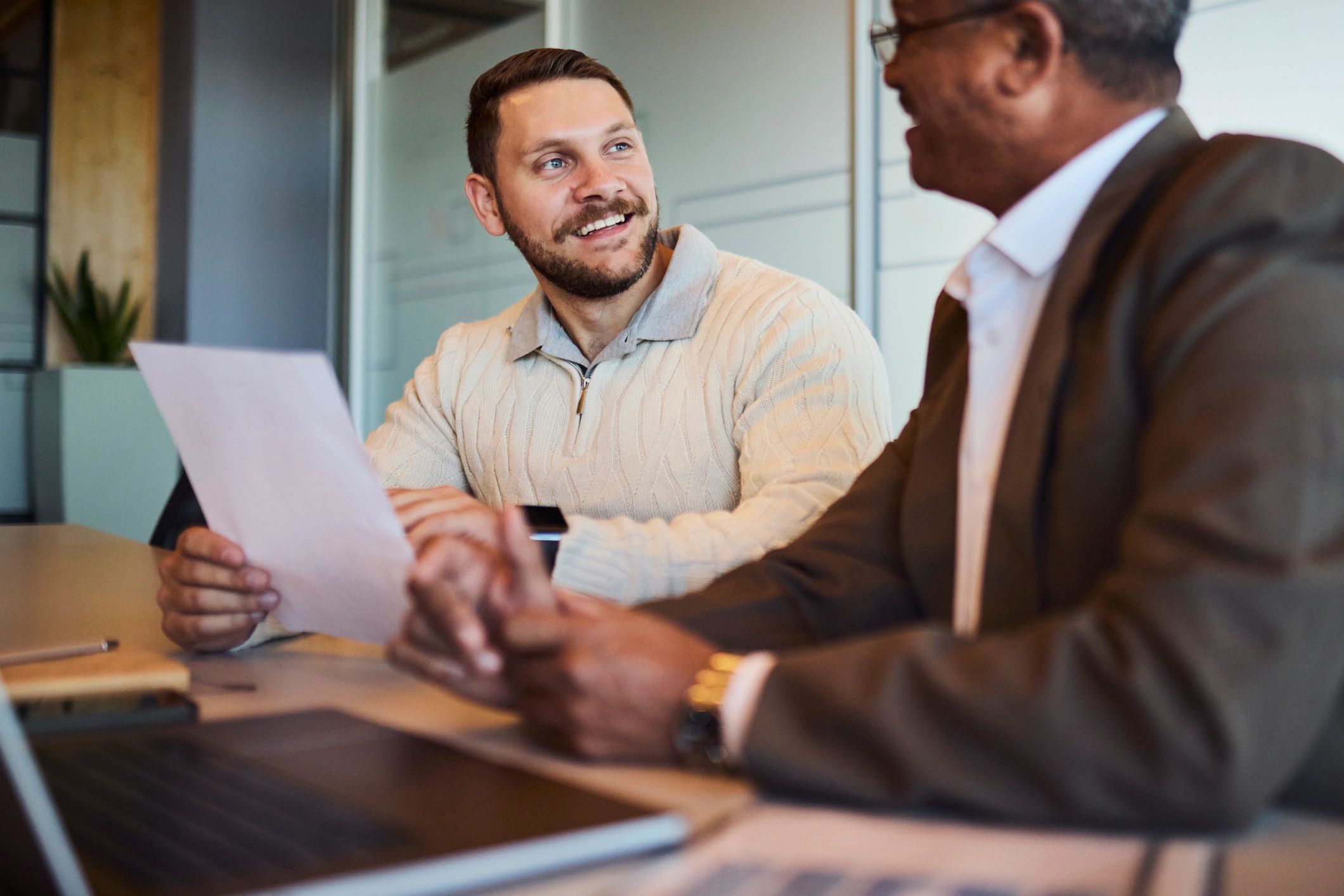 Finance consultation between professionals reviewing paperwork